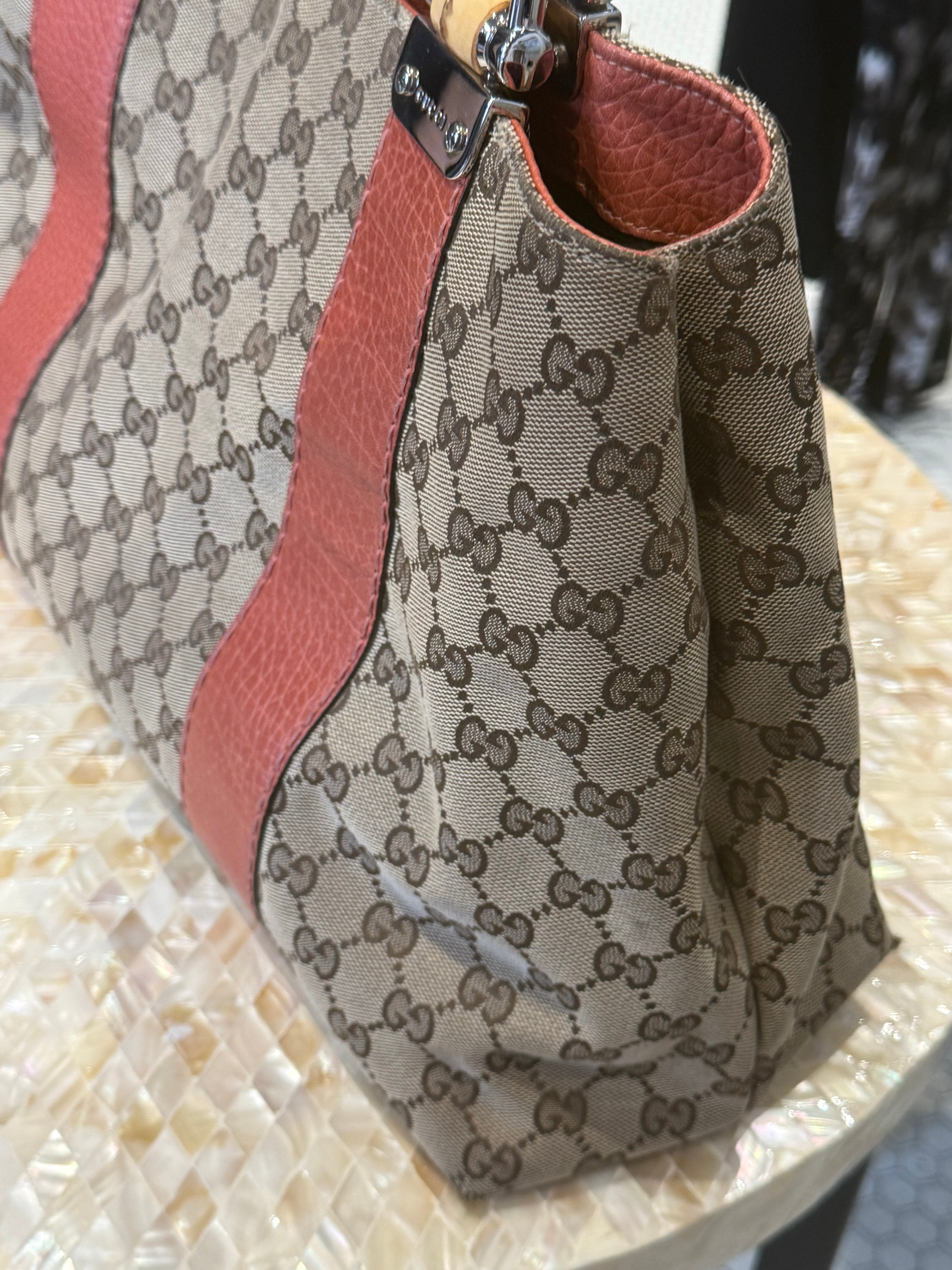 Vintage Gucci handbag with orange leather trim